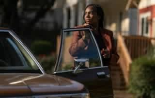 deborah ayorinde steps out of her detective car in them the scare still 1